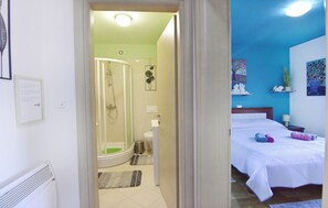 Shower, hair dryer, towels, toilet paper