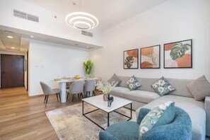 Standard Apartment, City View | Living area | 65-inch Smart TV with cable channels - Barsha Heights Near DIC Metro & Mall (Dubai)