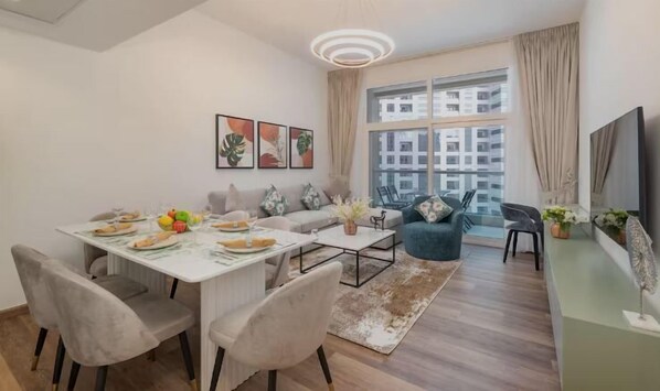 Standard Apartment, City View | Living area | 65-inch Smart TV with cable channels - Barsha Heights Near DIC Metro & Mall (Dubai)