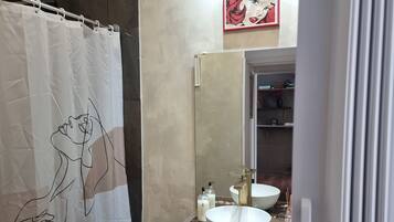 Shower, towels, soap, toilet paper