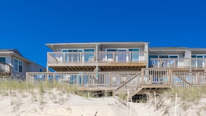 A beachfront property with a multi-level wooden deck and balconies. - Son Burn - 3BR Oceanfront Turtle Cove Townhouse (Surf City)
