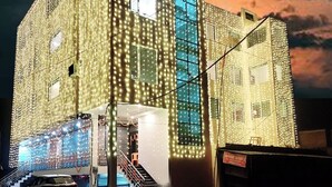 A building with a modern design, featuring a large glass facade and multiple windows. - Buddha Residency Sravasti by DD (Ikauna)