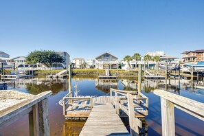 Stroll along the marina's wooden dock, offering access to calm waters and scenic views.