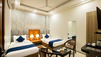 Premium bedding, memory-foam beds, laptop workspace, soundproofing