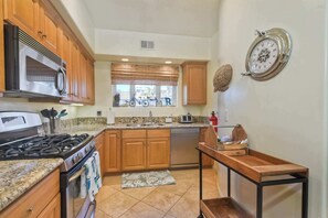 The open, airy kitchen offers ample space & every home comfort - South Pacific – Walk to Beach! (Oceanside)