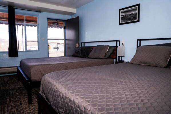 Desk, laptop workspace, blackout drapes, free WiFi - Maverick Motel and Glamp Ground (Raton)
