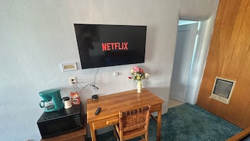 Desk, laptop workspace, blackout curtains, free WiFi