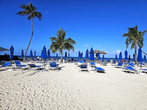 On the beach, sun loungers, beach towels