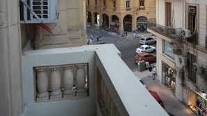 A multi-story building with balconies, air conditioning units, and a street view. - Charming Oasis in the Heart of Cairo – Authentic Hospitality Awaits! (Cairo Governorate)