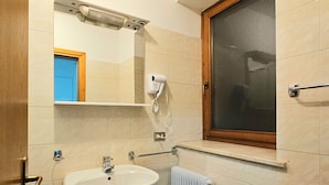 A bathroom with two sinks, a mirror, a hairdryer, and a window. - Ht TEA San Pellegrino (Canale d'Agordo)