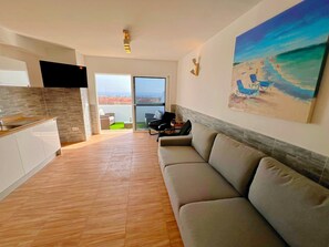 Comfort Bungalow, Sea View | Living area | 42-inch Smart TV with satellite channels - Sea View Bungalow with Communal Pool (Antigua)