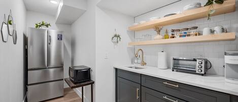 Fridge, microwave, coffee/tea maker, toaster