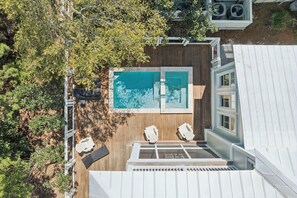 A rooftop pool with a wooden deck and two lounge chairs. - Magnolia Way|Private Community Beach Access|Watercolor Home w/ Private Pool (Watercolor)
