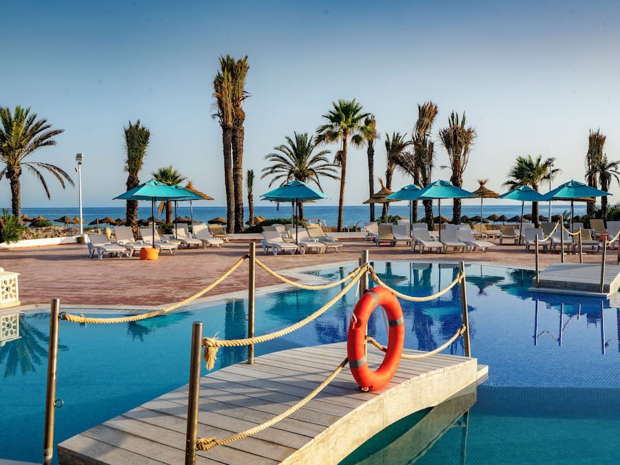 3 outdoor pools, open 9:00 AM to 6:00 PM, pool umbrellas, pool loungers