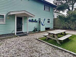 A light blue building with a sign reading "Coves for You" and an anchor symbol.