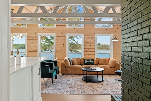 Spacious great room with endless panoramic lake views.