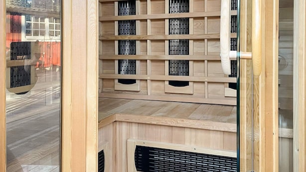 A room with a wooden slat partition, a window, and a door. - 4 Person Holiday Home in Monsteras (Monsteras)