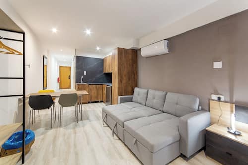 Deluxe Suite | Living area | 55-inch Smart TV with digital channels, Netflix, streaming services