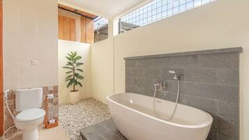 Deluxe Suite, Patio, Pool View | Bathroom | Combined shower/tub, free toiletries, hair dryer, slippers