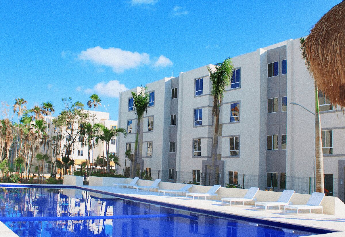 A modern hotel with a pool, white lounge chairs, and palm trees.