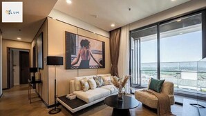 Panoramic Apartment, 2 Bedrooms, Balcony, City View | Living area - Lumiere Riverside Residences Luxury (Ho Chi Minh City)