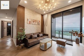 Presidential Apartment, 1 Bedroom, Patio, City View | Living area | 65-inch flat-screen TV with cable channels