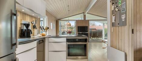 Fridge, stovetop, dishwasher, coffee/tea maker