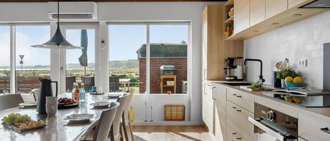 Fridge, stovetop, dishwasher, coffee/tea maker
