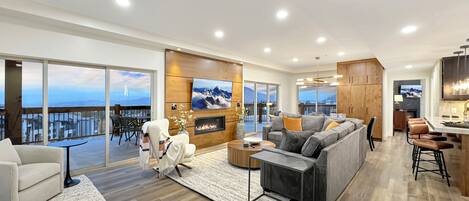 Smart TV, chimenea, mesa de ping pong, libros