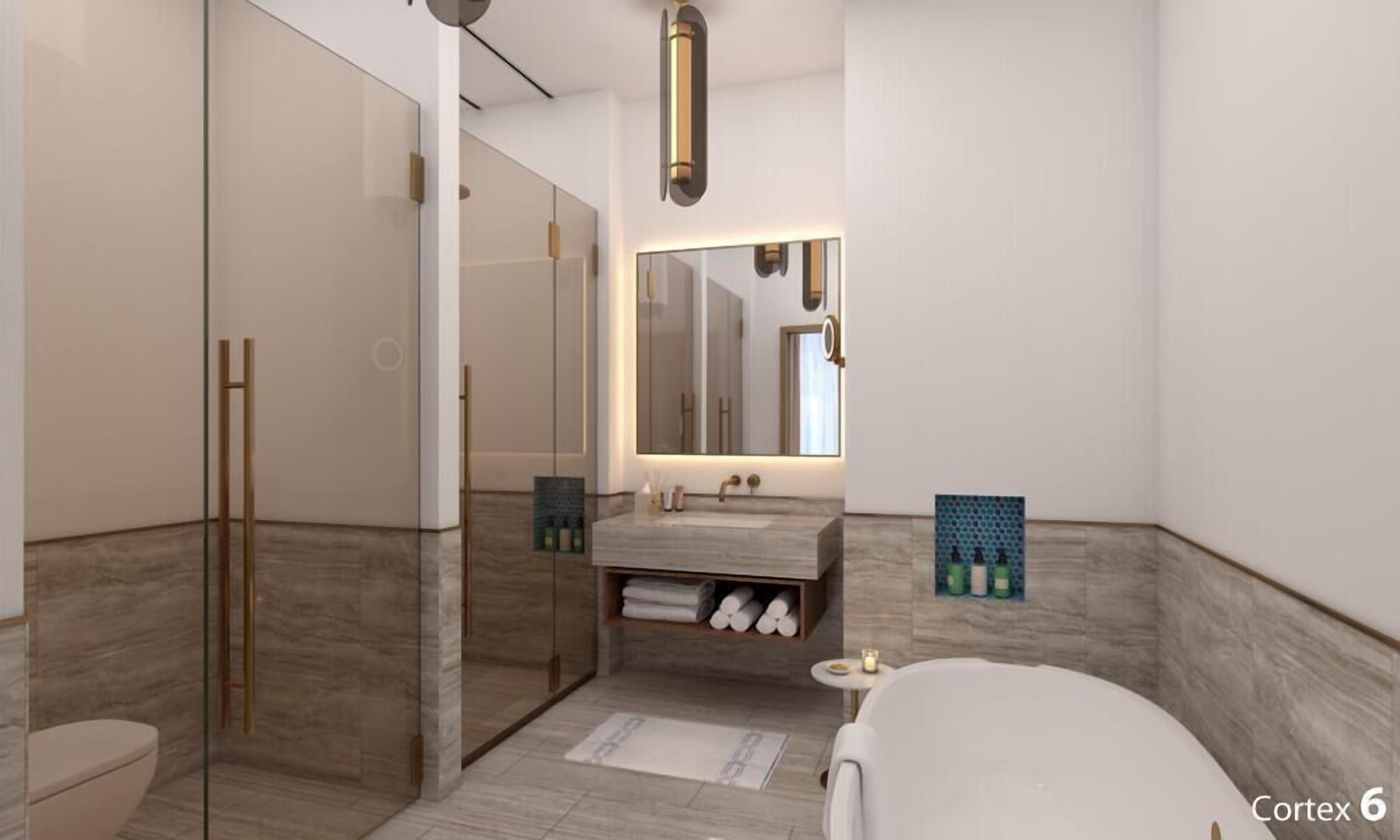 Un baño moderno con cabina de ducha de vidrio, tocador con espejo y bañera.