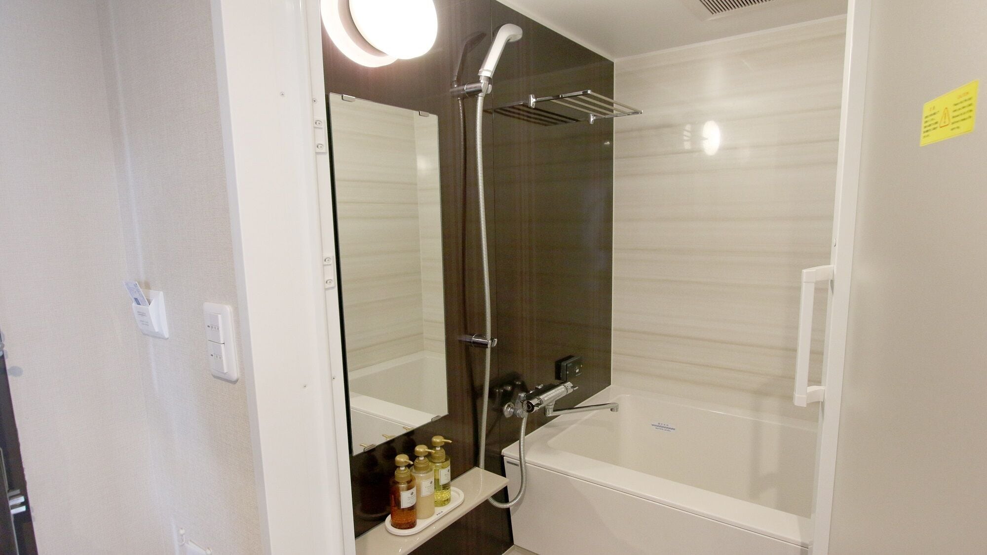 Separate tub and shower, free toiletries, hair dryer, slippers