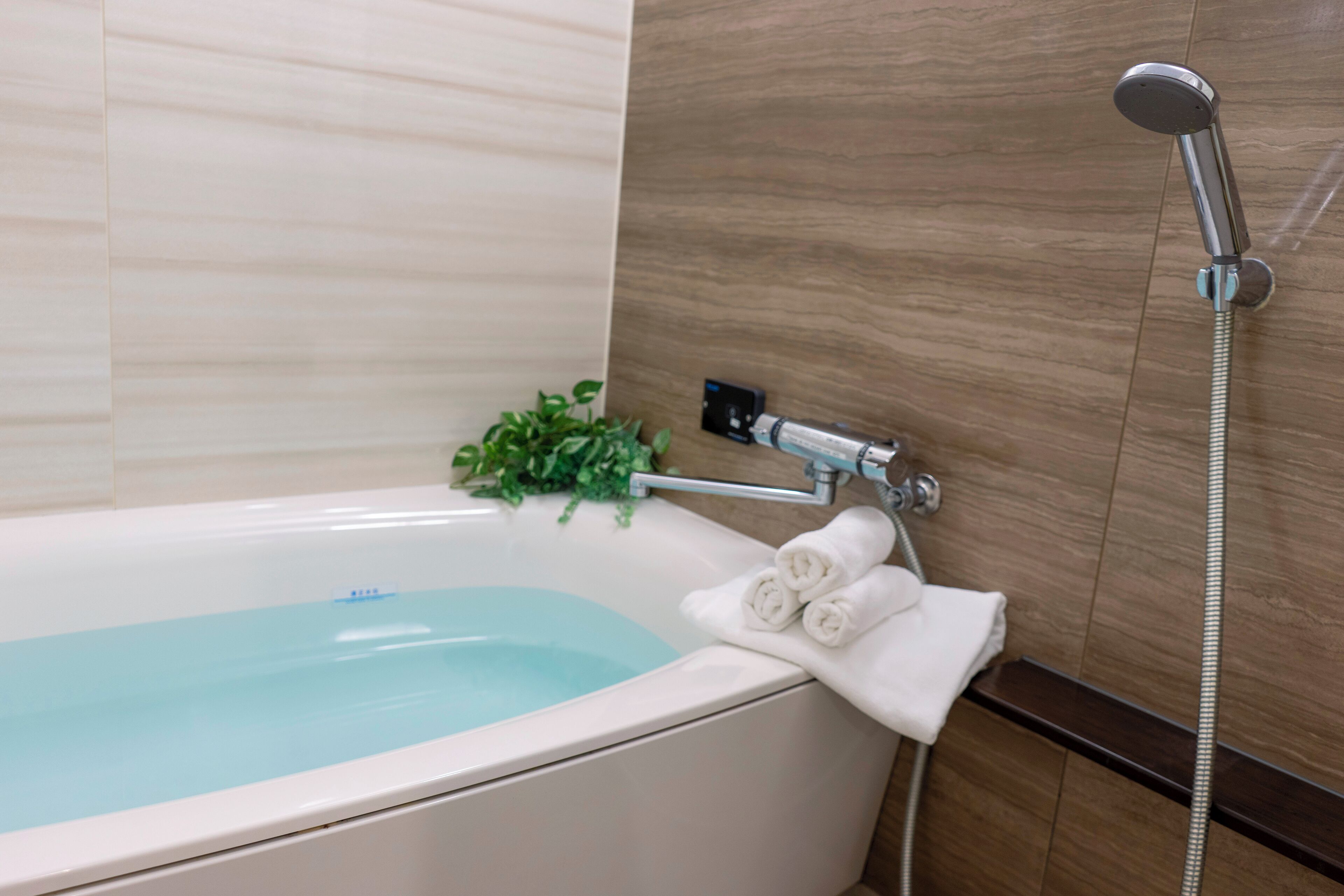 Renewal Triple Room, Non Smoking | Bathroom | Separate bathtub and shower, free toiletries, hair dryer, slippers