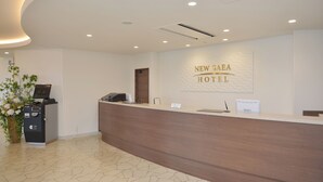 A reception desk with a sign reading "NEW GAEA HOTEL". - Hotel New Gaea Nishi Kumamoto Ekimae (Kumamoto)