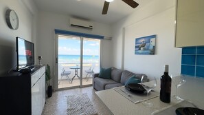 Apartment, 1 Bedroom, Smoking, Balcony | Living room | Books - Kolonaki Seaview 1bdr Finikoudes (Larnaca)