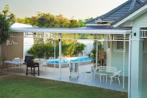 Villa, Pool View | Living area | 32-inch flat-screen TV with cable channels