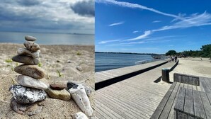A stack of stones on a sandy beach and a wooden pier extending into a body of water. - Living with a harbor view—200 meters from the South Beach on the island of Rügen (Altefähr)