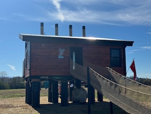 A wooden structure with a sign reading "Jack & Rose" and a flag.
