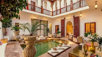 Outdoor pool, open 8:00 AM to 8:00 PM, sun loungers