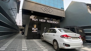 A modern building with a sign reading "W&H VIEW RESIDENCY". - W & H View Residency (Kochi)