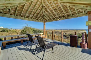 A wooden deck with two chairs and a bench, overlooking a beach and dunes. - 3206 Island Club - Folly Field - 2 Bed 2 Bath Sleeps 5 - Hilton Head Rentals (Hilton Head Island)