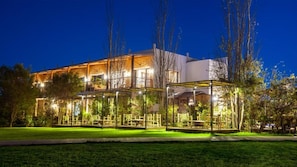 A two-story building with a covered outdoor seating area. - Bio et bois - Luxury Bio farm (Ain Chkef)