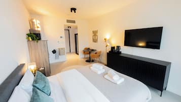 Studio, City View | Living area | 25-inch flat-screen TV with cable channels