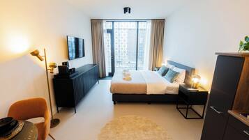 Studio, City View | Living area | 25-inch flat-screen TV with cable channels