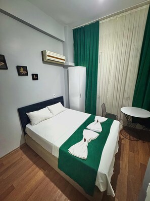 Premium bedding, desk, laptop workspace, blackout curtains