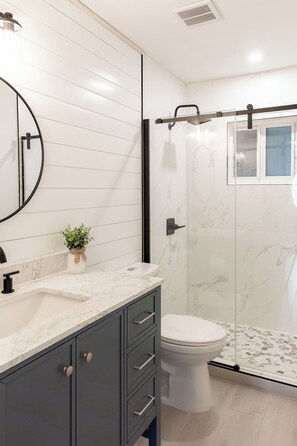 Shower, hair dryer, towels, soap