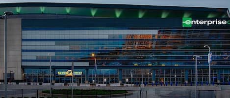A modern building with a glass facade and a sign for "Enterprise."