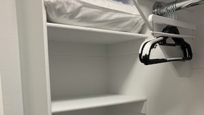 A white closet with multiple shelves and a hanging rod. - 1,2,3,4 Escape comfort & style. You'll love it!" (Las Vegas)