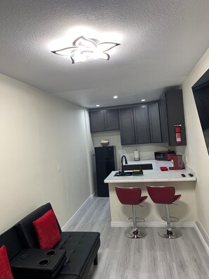 Fridge, microwave, stovetop, coffee/tea maker