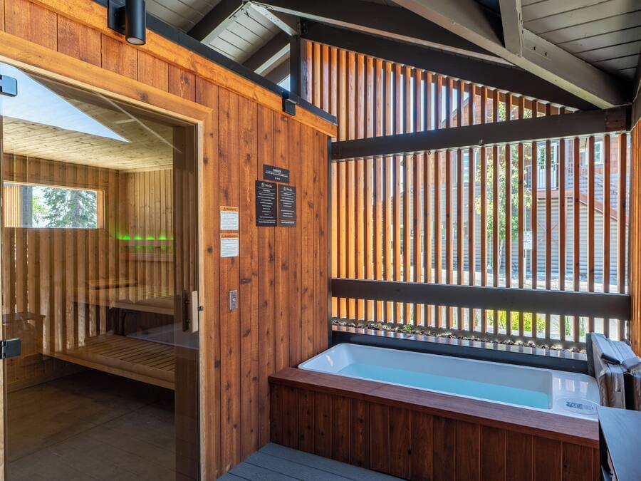 A wooden spa area with a hot tub and a sauna.