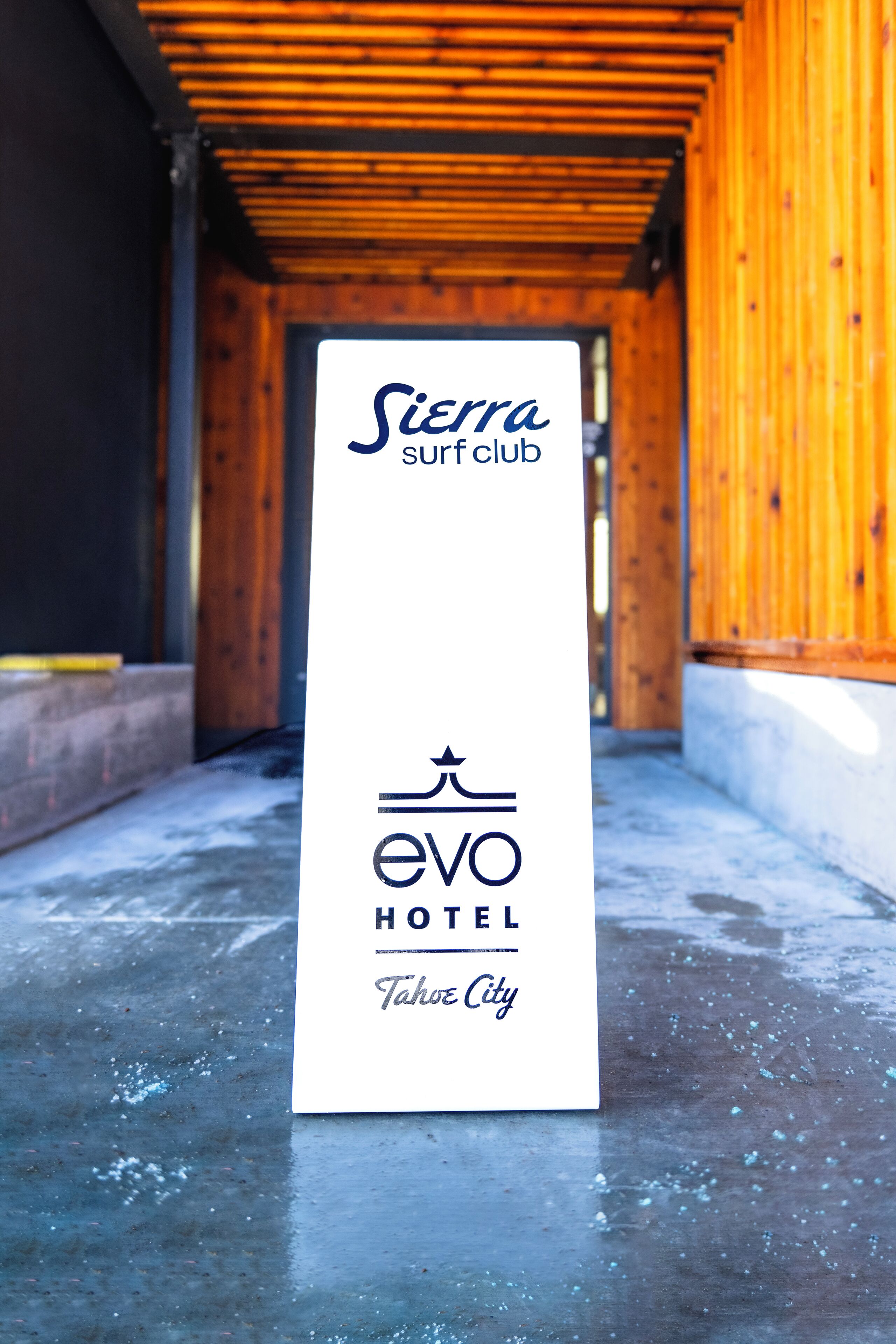 A sign for Sierra surf club and EVO Hotel in Tahoe City.